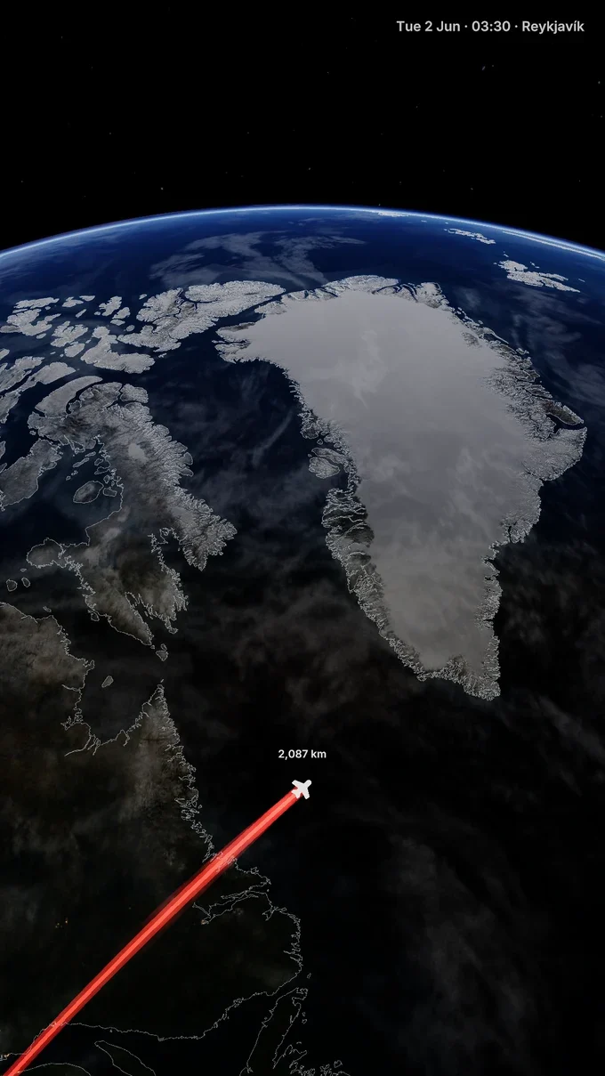 A raised red flight arc crossing the North Atlantic toward Reykjavík
